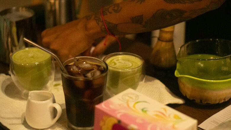 Barista preparing matcha lattes and coffee at The Shala Grounds cafe at Kahana Baler in Cemento, Baler