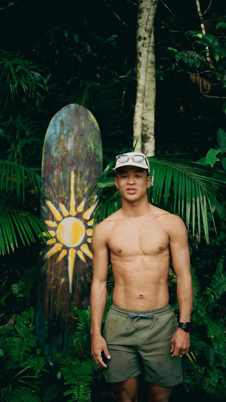 Sun-painted wooden surfboard surrounded by lush tropical foliage near Kahana Baler, Cemento, Baler, Aurora